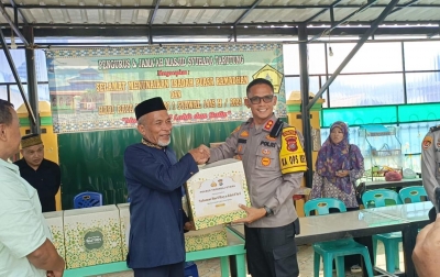 Polres Taput Serahkan Paket Lebaran Kapolda kepada Anak Yatim dan Tokoh Masyarakat