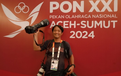 Risky Cahyadi, Fotografer Media Official PON XXI Aceh-Sumut 2024 Jadi Idola Atlet Gulat