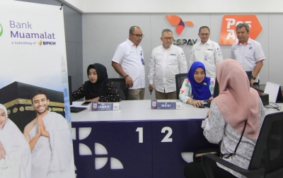 PosIND dan Bank Muamalat Hadirkan Layanan Tabungan Haji di Kantor Pos